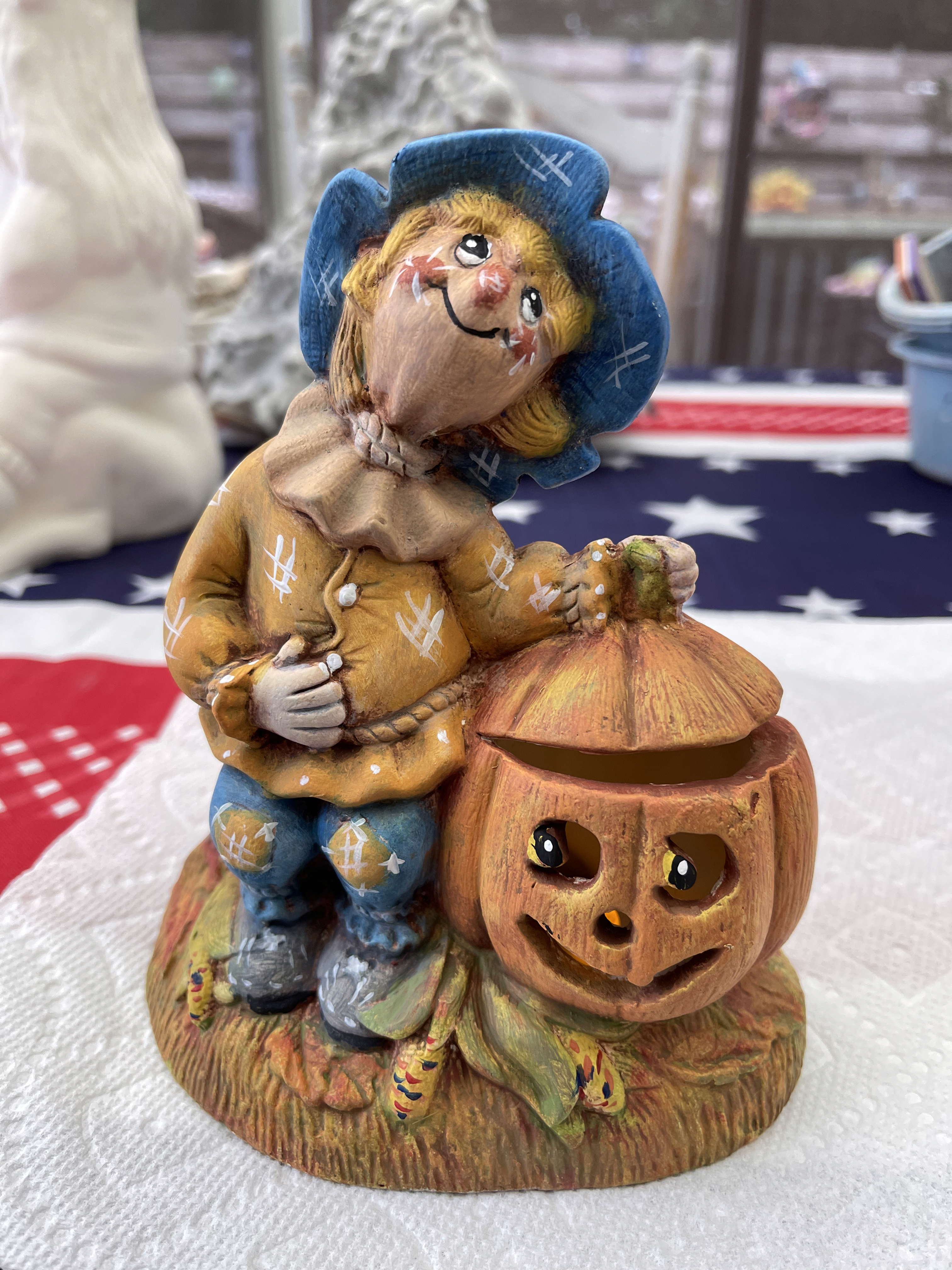 Ceramic scarecrow and pumpkin